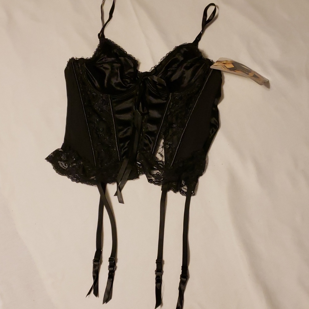 A sexy black corset with garters.